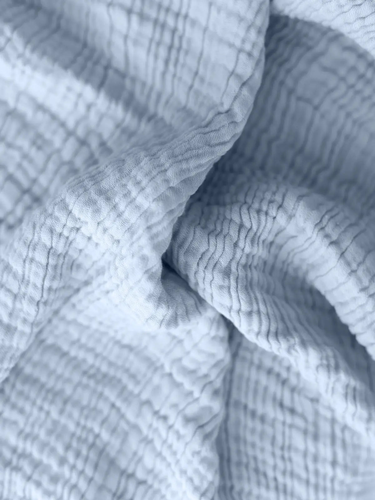 Bebe mavisi muslin yatak örtüsü kumaş dokusu yakın çekim