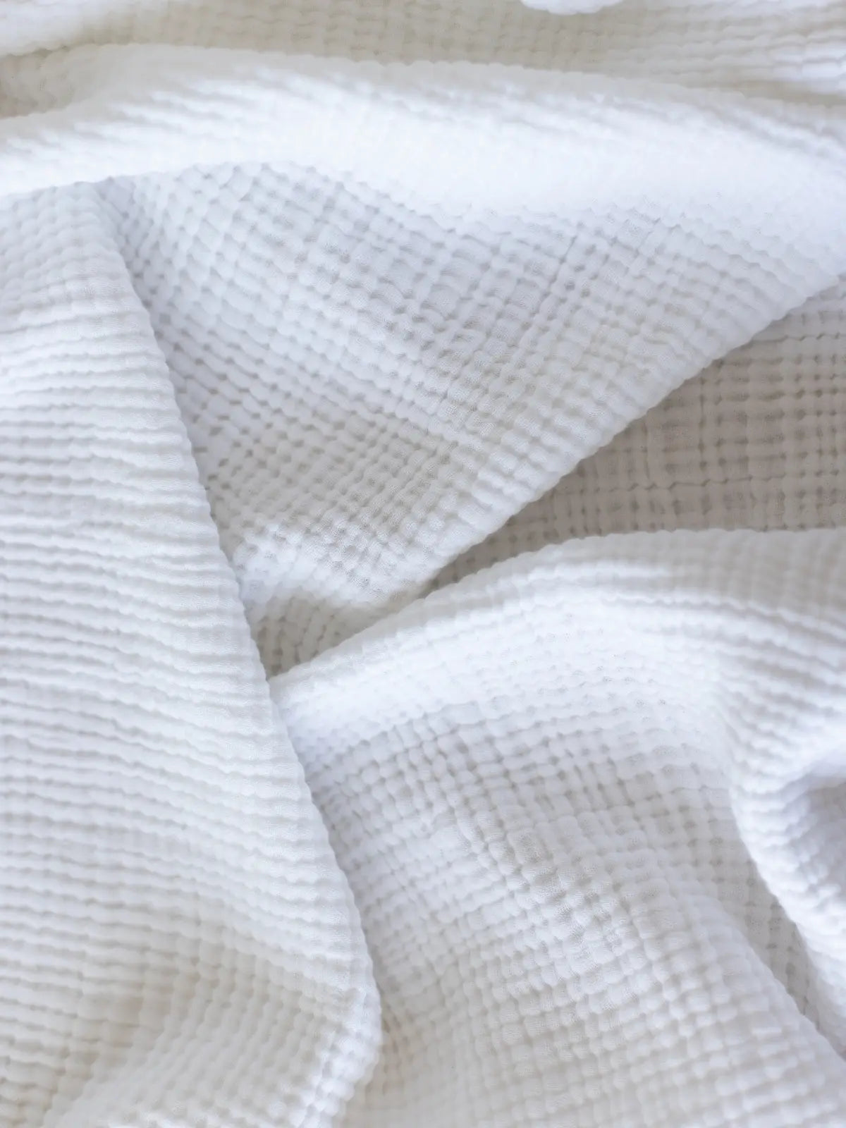 Beyaz muslin yatak örtüsü kumaş dokusu yakın çekim