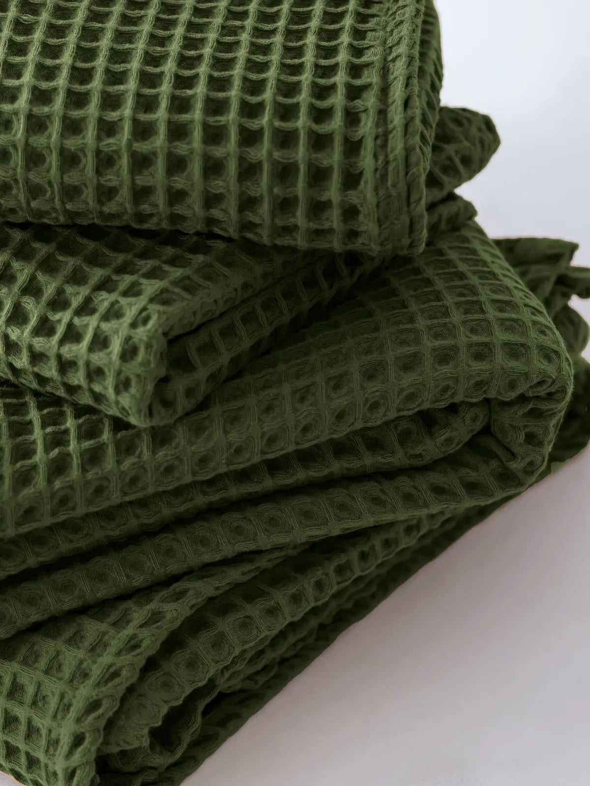 Koyu yeşil petek havlu zengin renk doku kombinasyonu