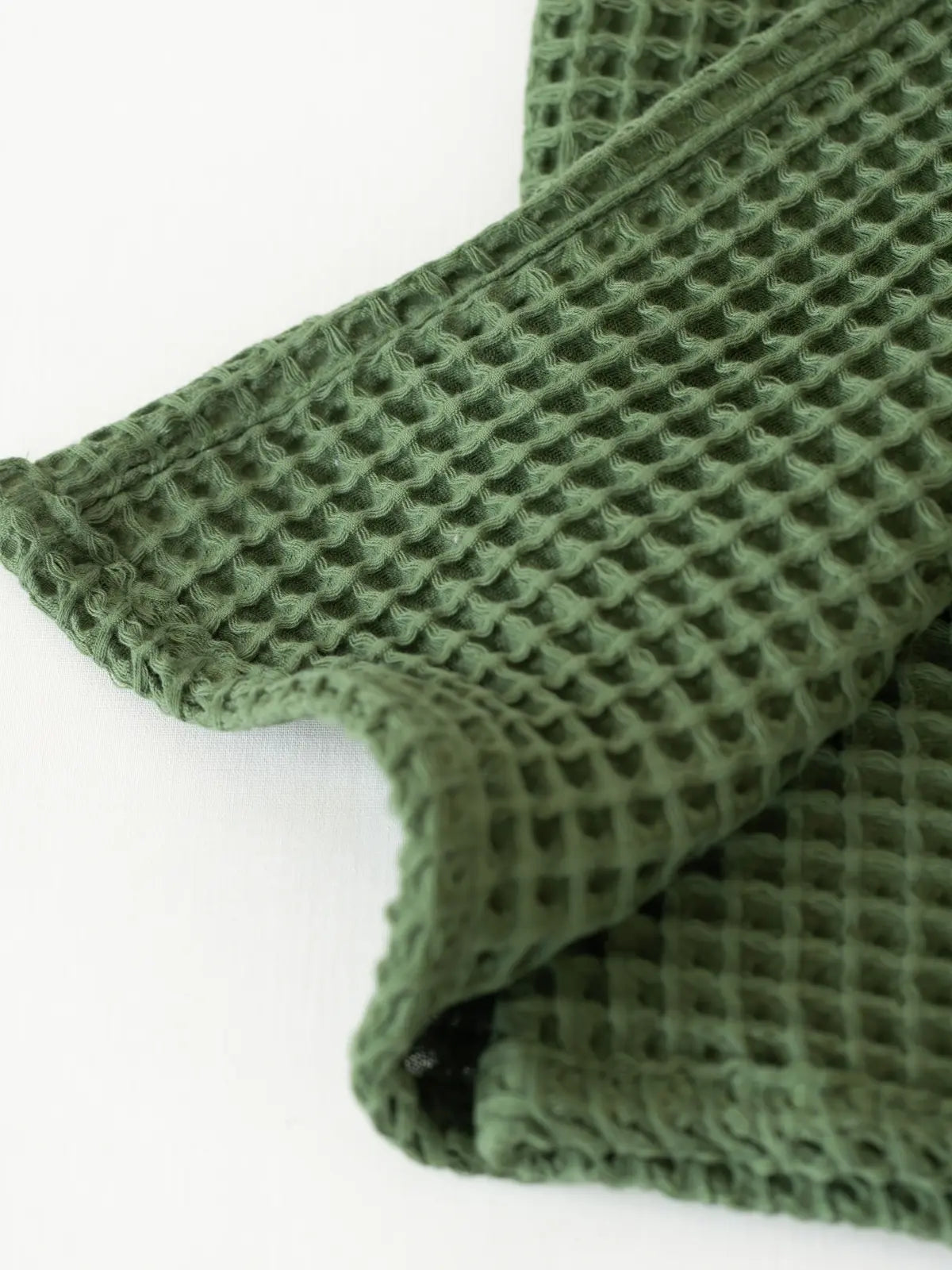 Koyu yeşil waffle havlu petek doku detay yakın plan