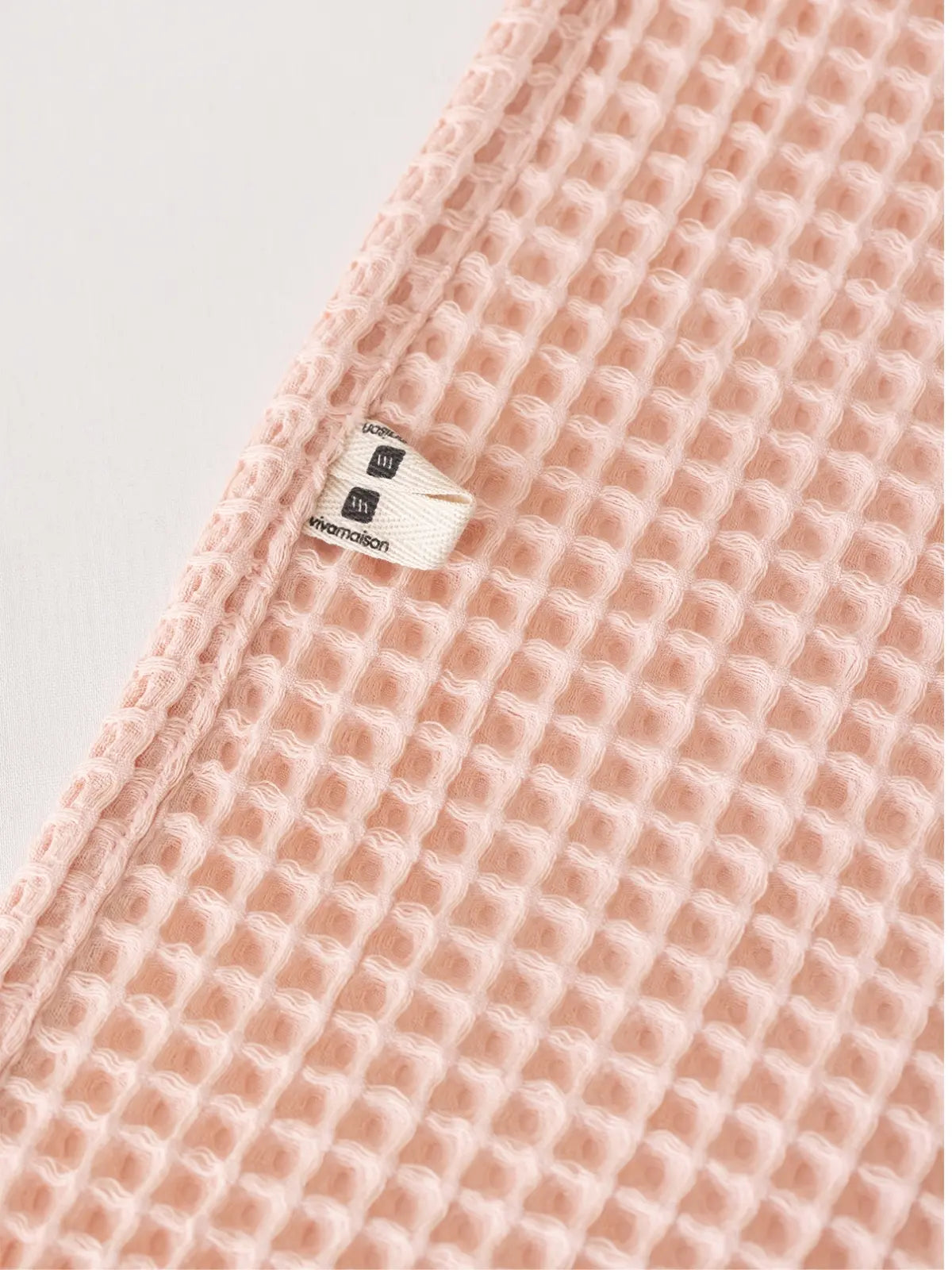 Pembe waffle havlu emici dokuma yapısı yakın plan